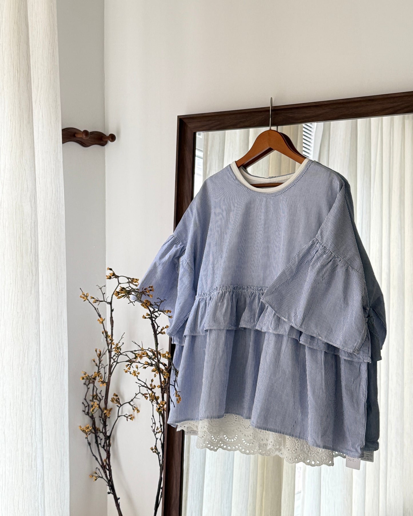 Step ruffle blouse